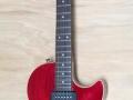SSC 33 Solid Single Cutaway  Transparant-Red 2011 Indonesie Alu Max Connect bridge, Twin CoAxe pickups, front.