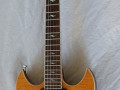 SDC 55 Solid Double Cutaway Transparant Amber Flame Maple 2011 Korea, Alu Max Connect bridge, Twin CoAxe pickups, front.