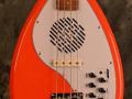 The Apache-1 Teardrop Bass 2013 Salmon Red, body front.